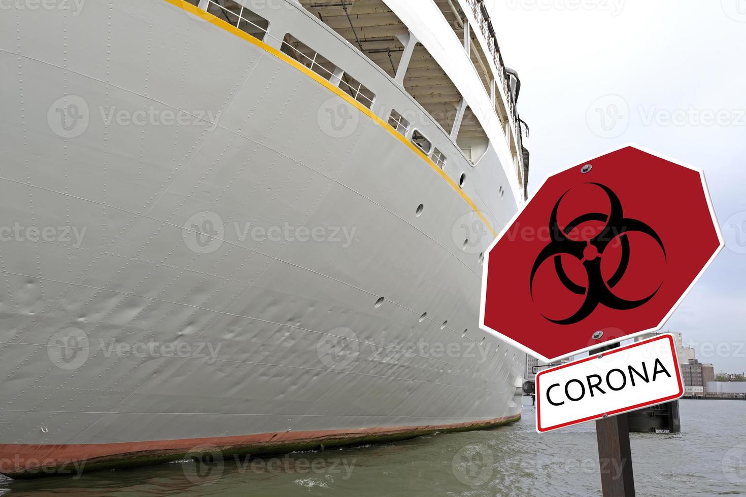 Cruise ship with a Coronavirus warning sign next to it photo