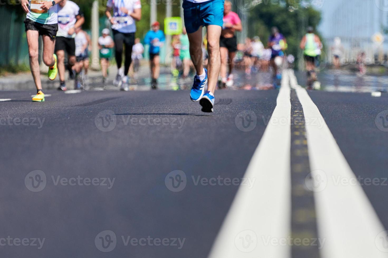 Runners on city road. photo