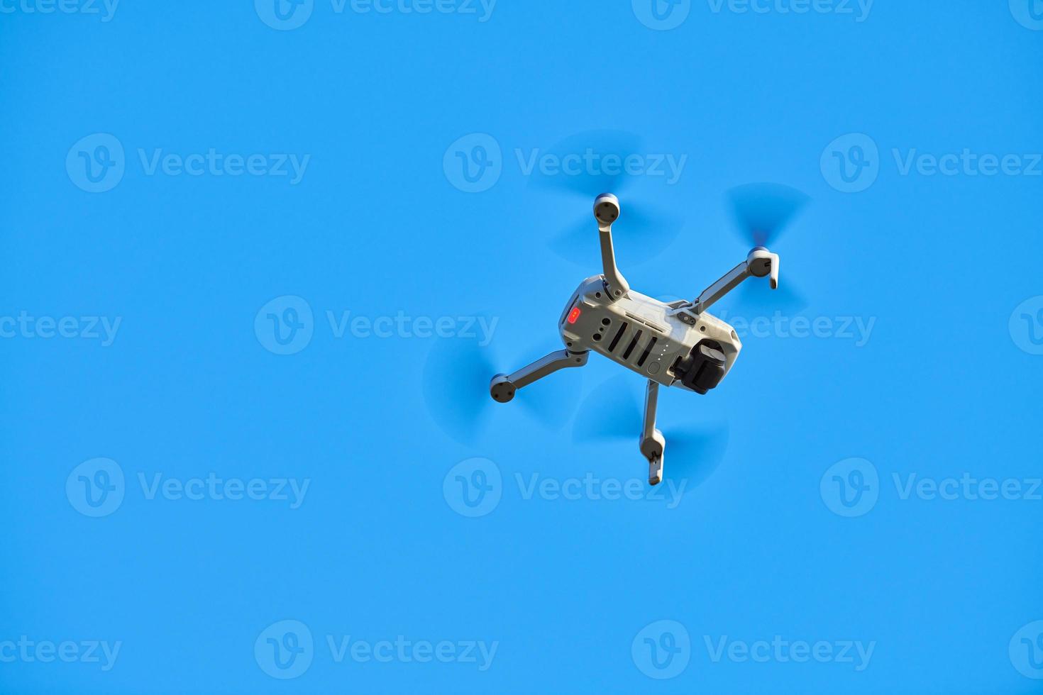 Quadcopter drone in sky photo