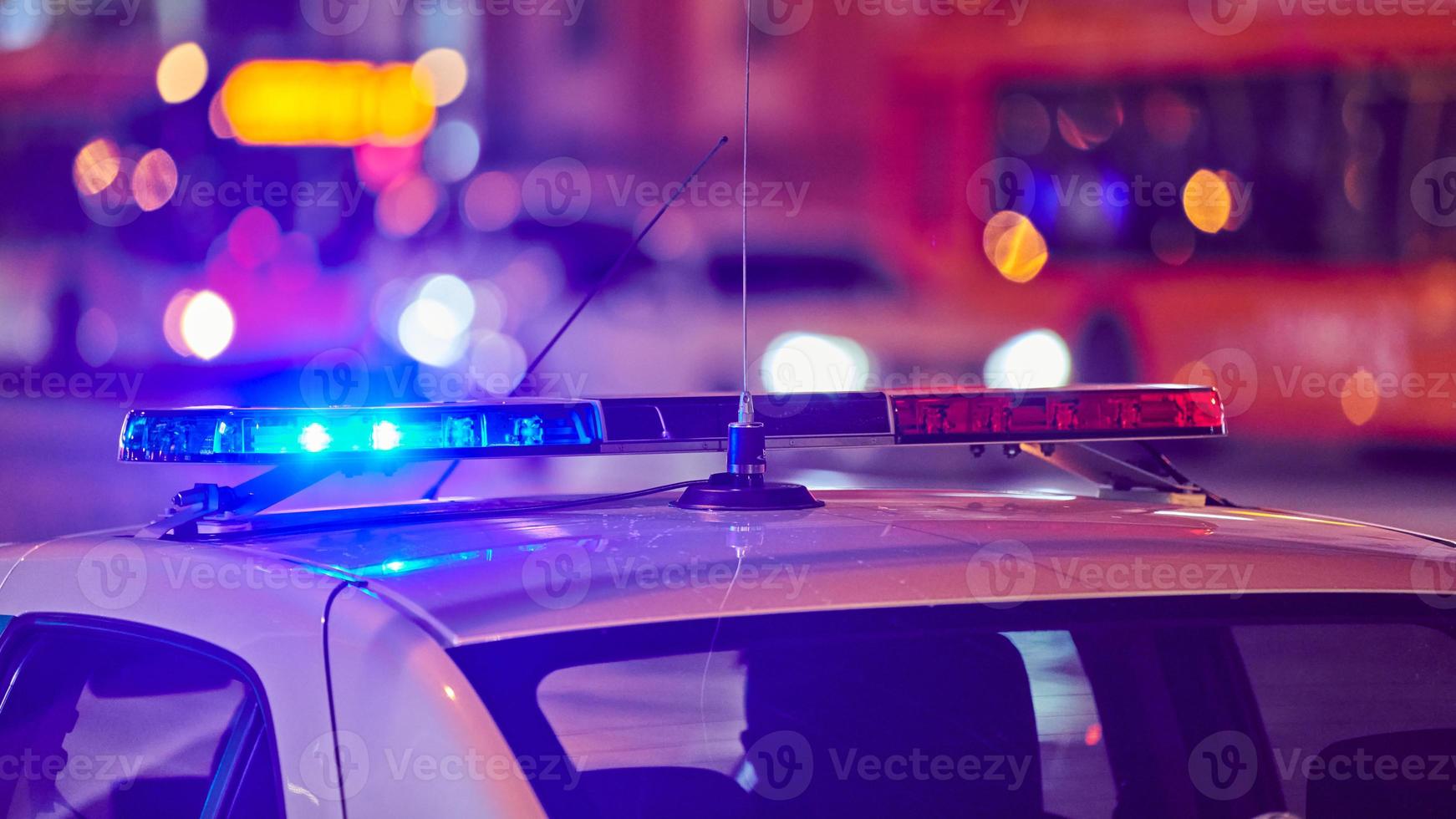 Police car lights at night city street photo