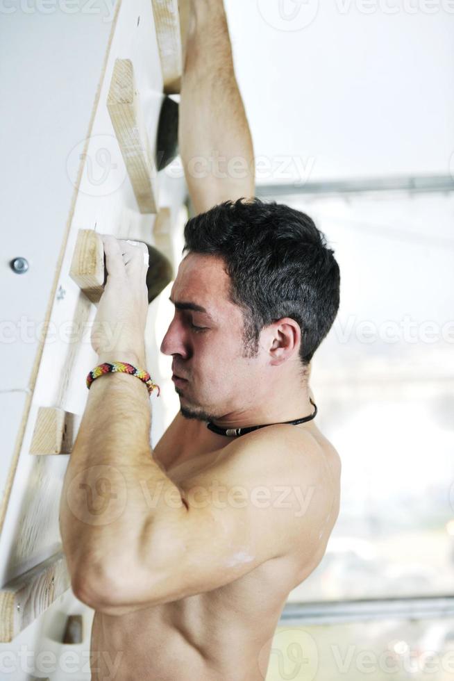 Man rock climbing photo