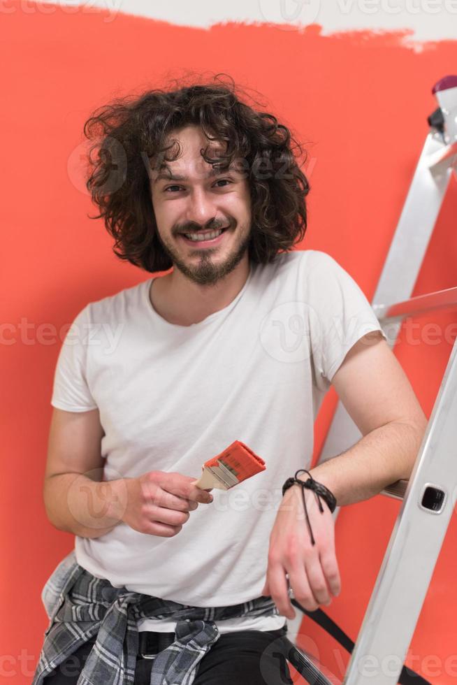 man with funny hair over color background with brush photo