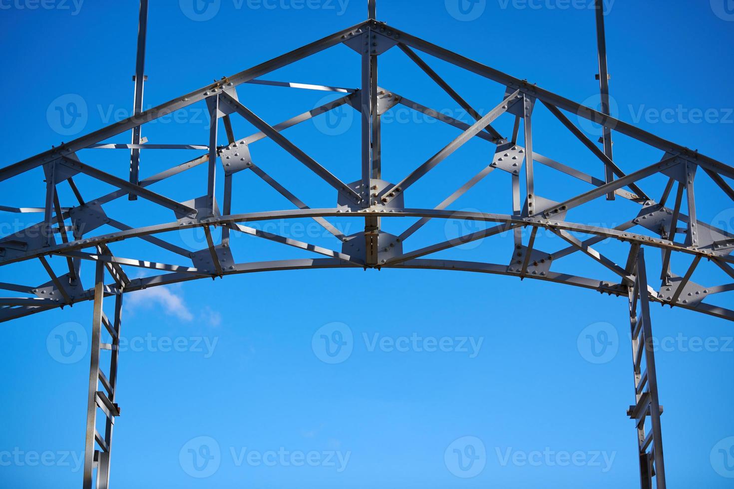 Frame of goods shed. Metal construction of railway building. Old abandoned steel warehouse for goods. photo