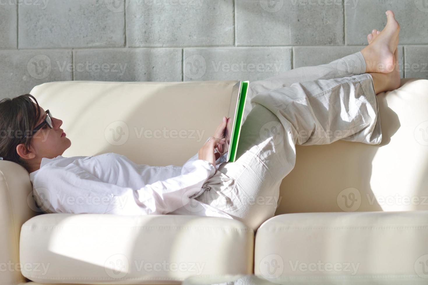 woman using tablet pc at home photo