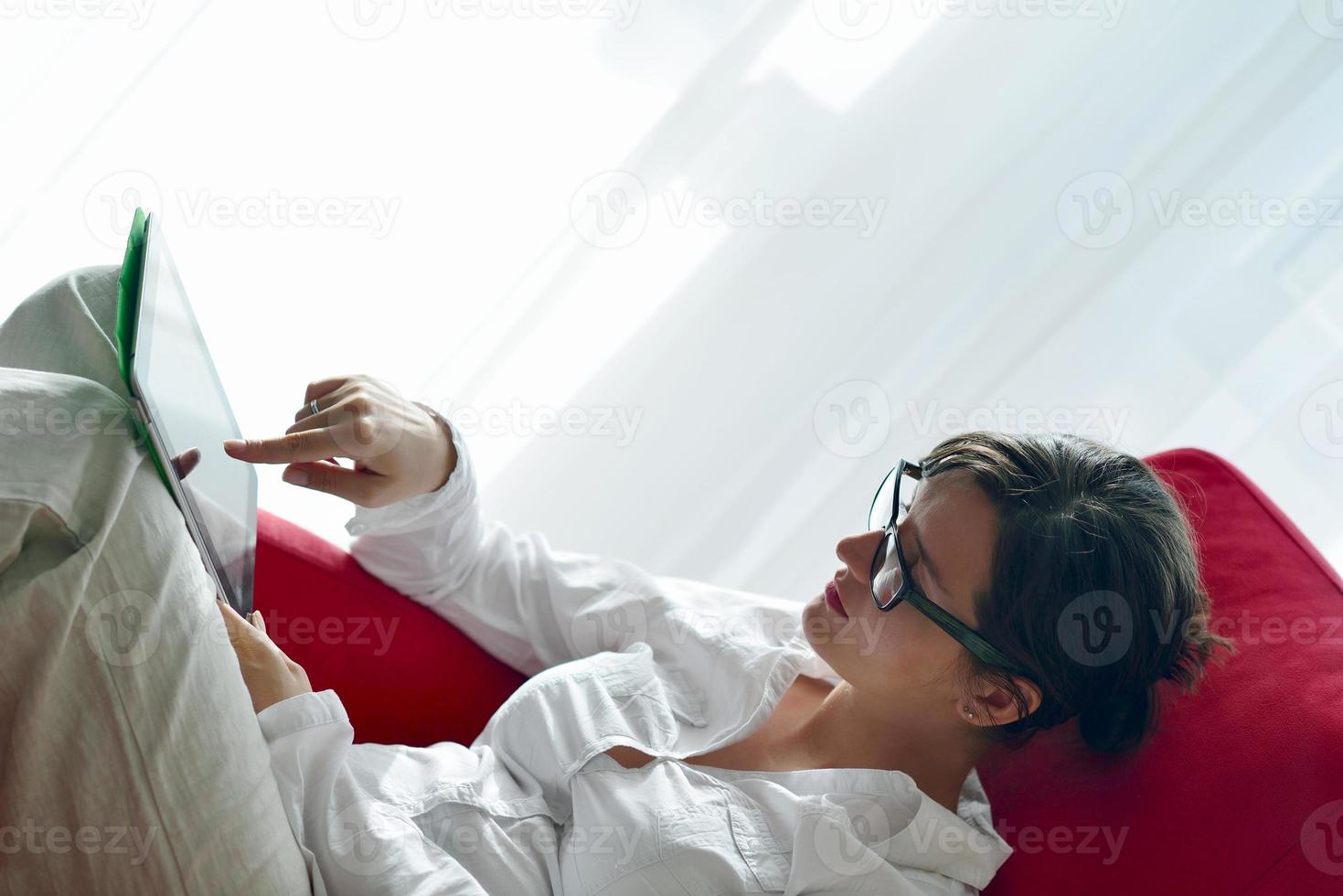 woman using tablet pc at home photo
