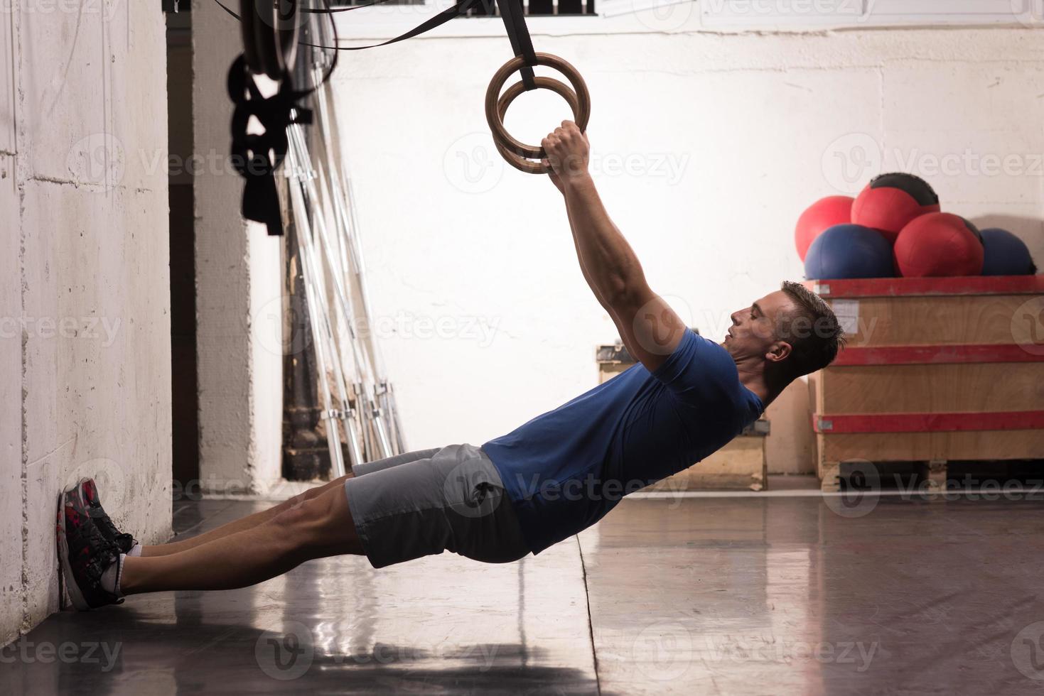 man doing dipping exercise photo
