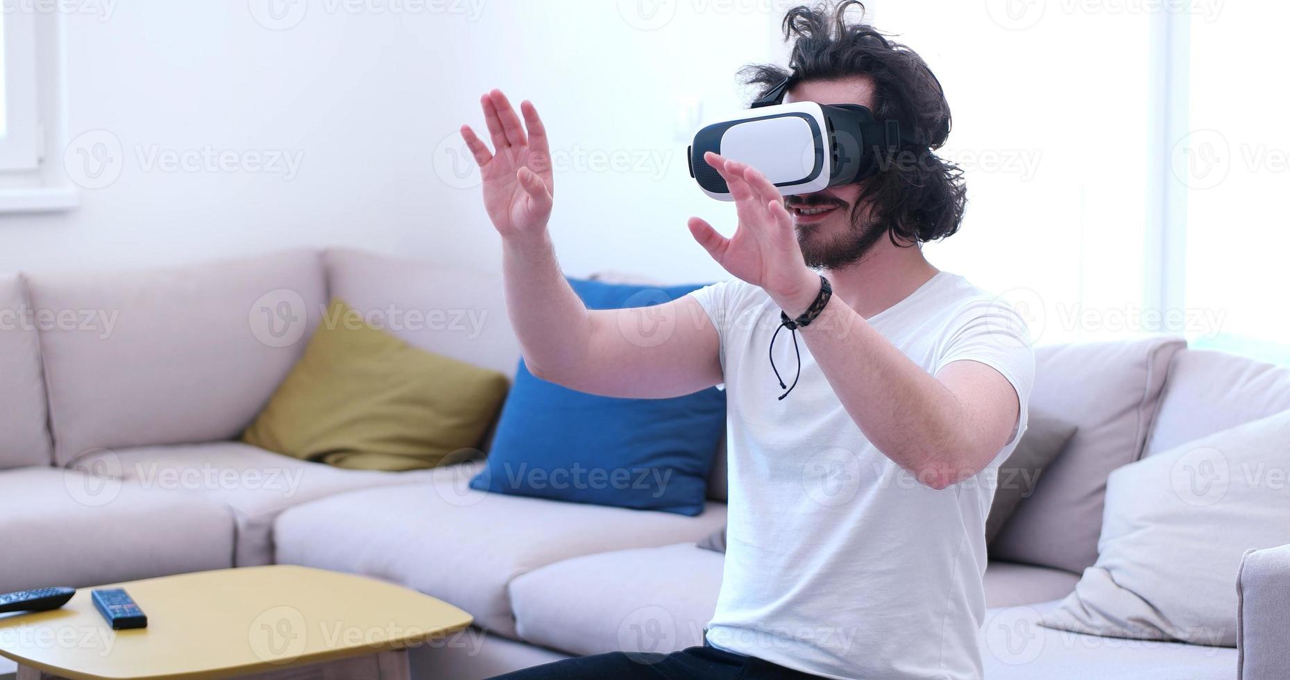 man using VR-headset glasses of virtual reality photo