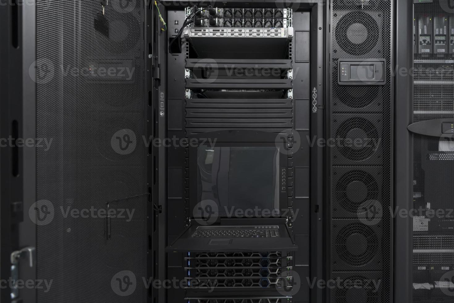 Data Center With Multiple Rows of Fully Operational Server Racks. Modern Telecommunications, Cloud Computing, Artificial Intelligence, Database, Supercomputer Technology Concept. photo