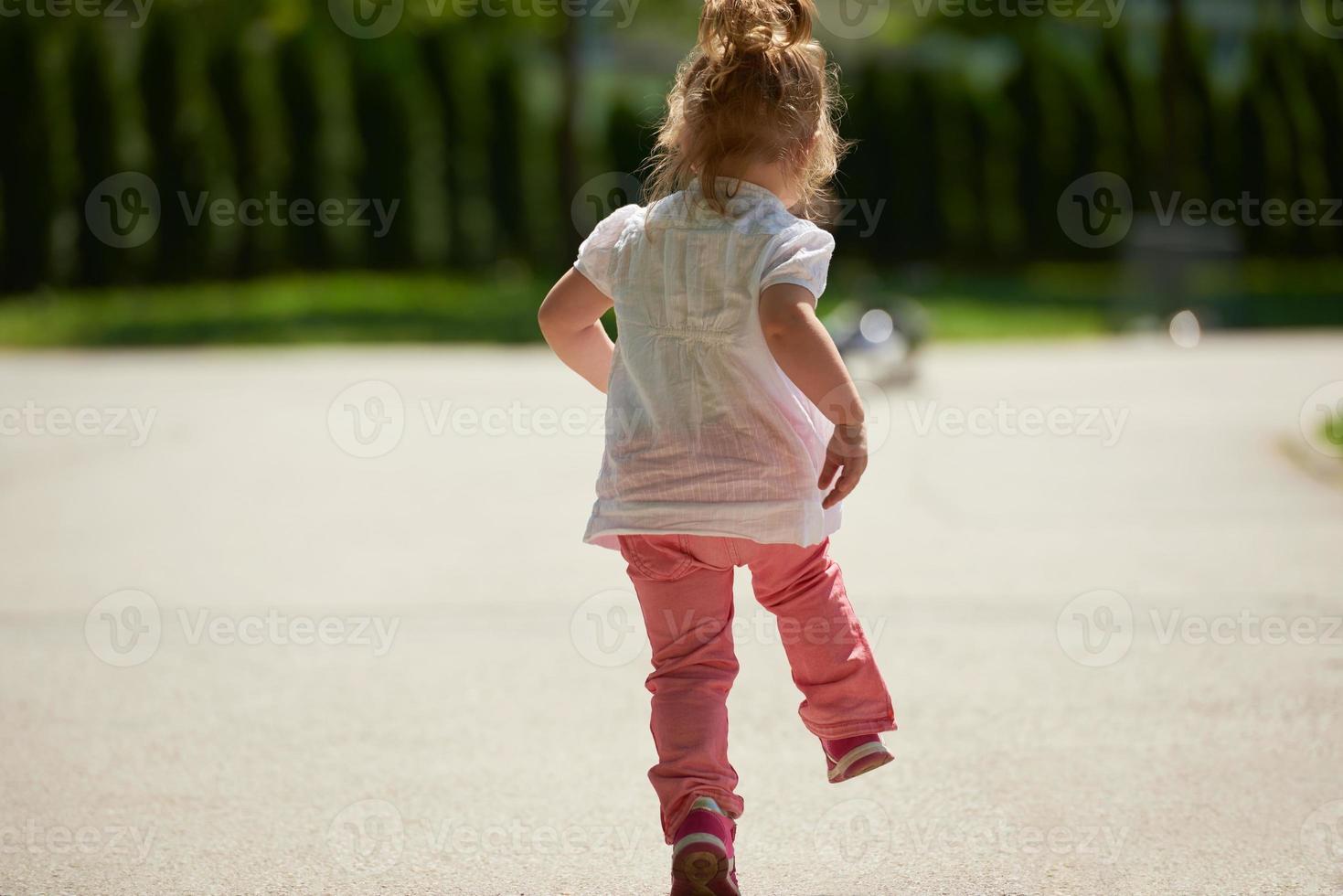 little girl have fun in park photo