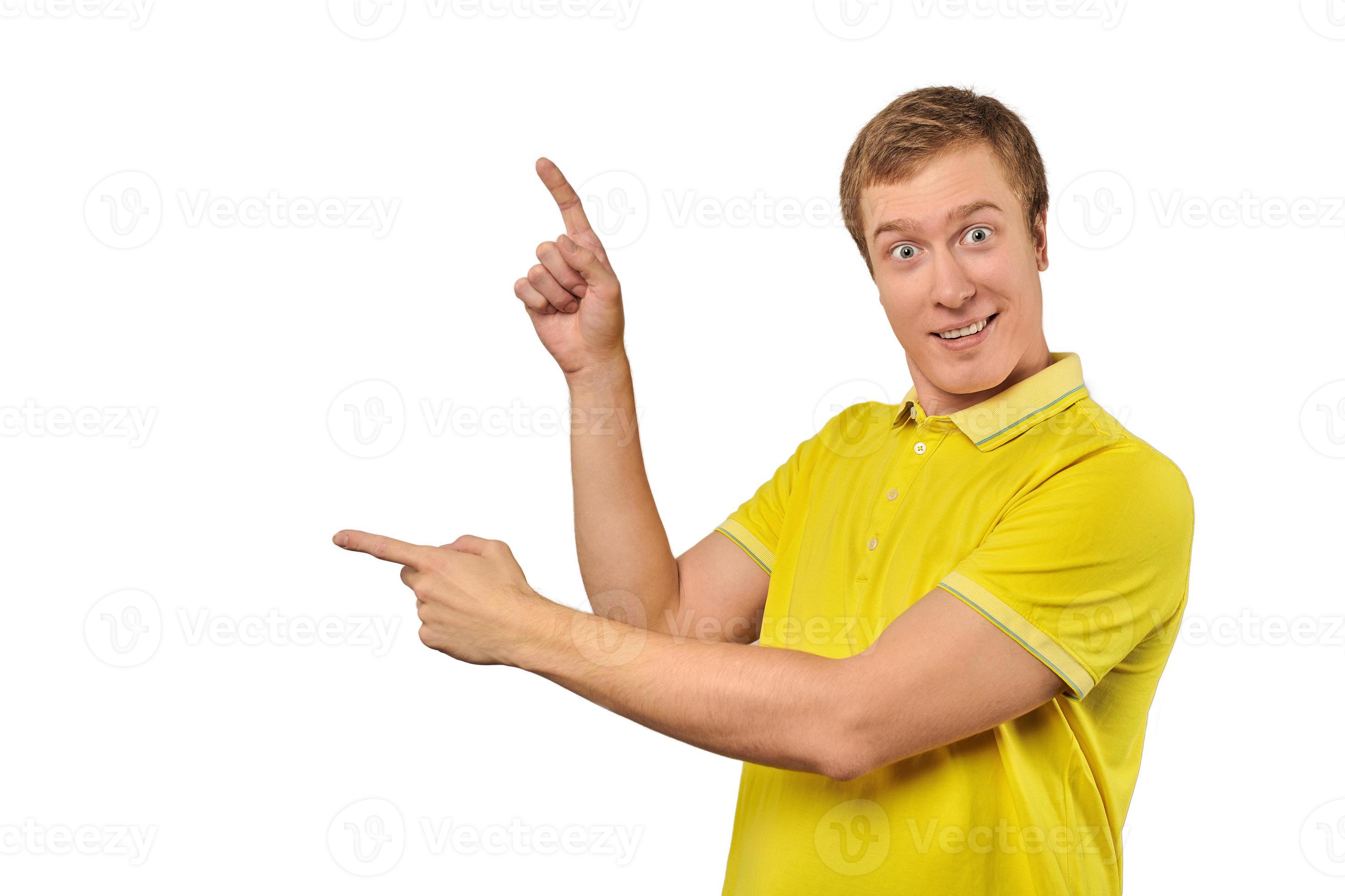 Surprised guy with funny face in yellow Polo T-shirt pointing finger to left, white background 11308662 Stock Photo at Vecteezy Surprised guy with funny face in yellow Polo T-shirt pointing finger to left, white background 11308662 Stock Photo at Vecteezy