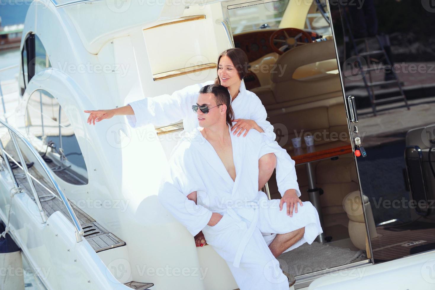 young couple on yacht photo