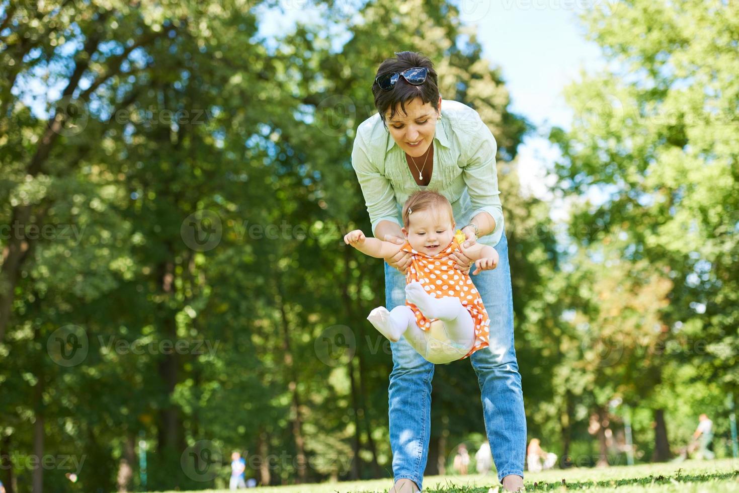 mother and baby in park photo