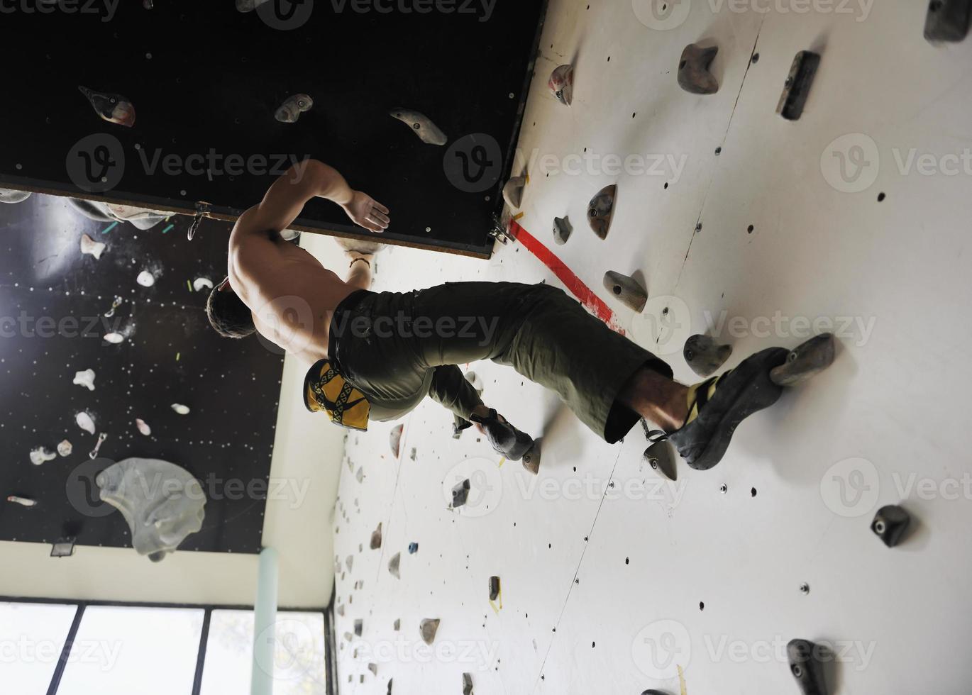 Man rock climbing photo