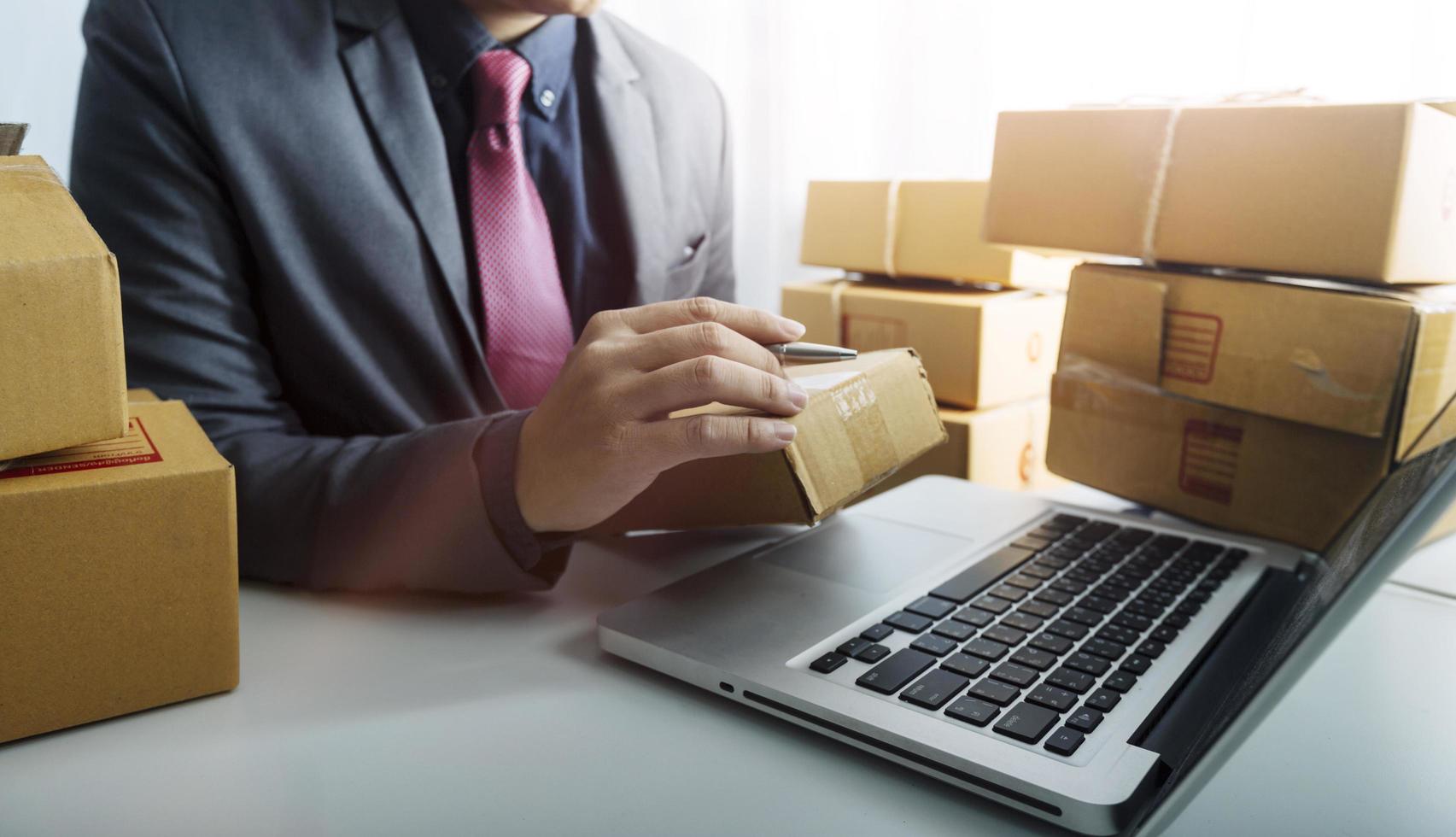 Online sales ideas for work at home. Asian man is answering phone calls. To accept orders from online customers.Very good sale. online Business and E-commerce.Online shop photo