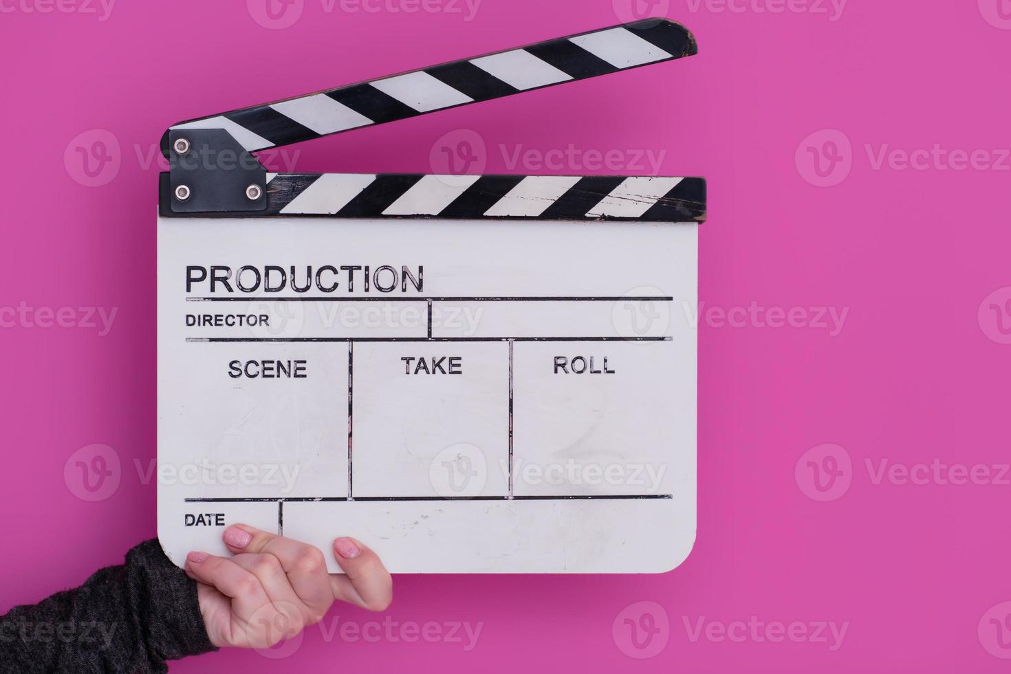 movie clapper on pink background photo