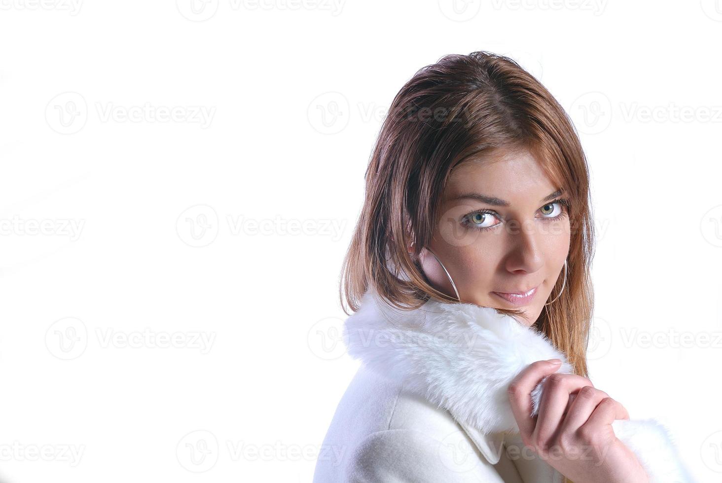 Isolated portrait of beautiful woman in a winter coat photo