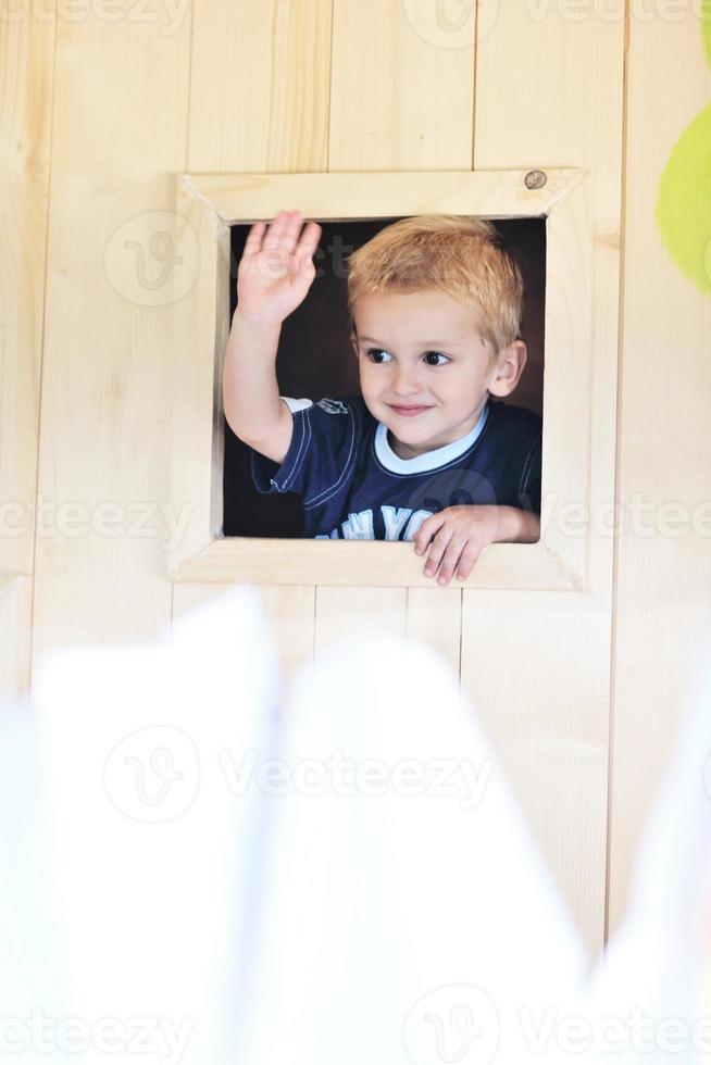 happy child in a window photo