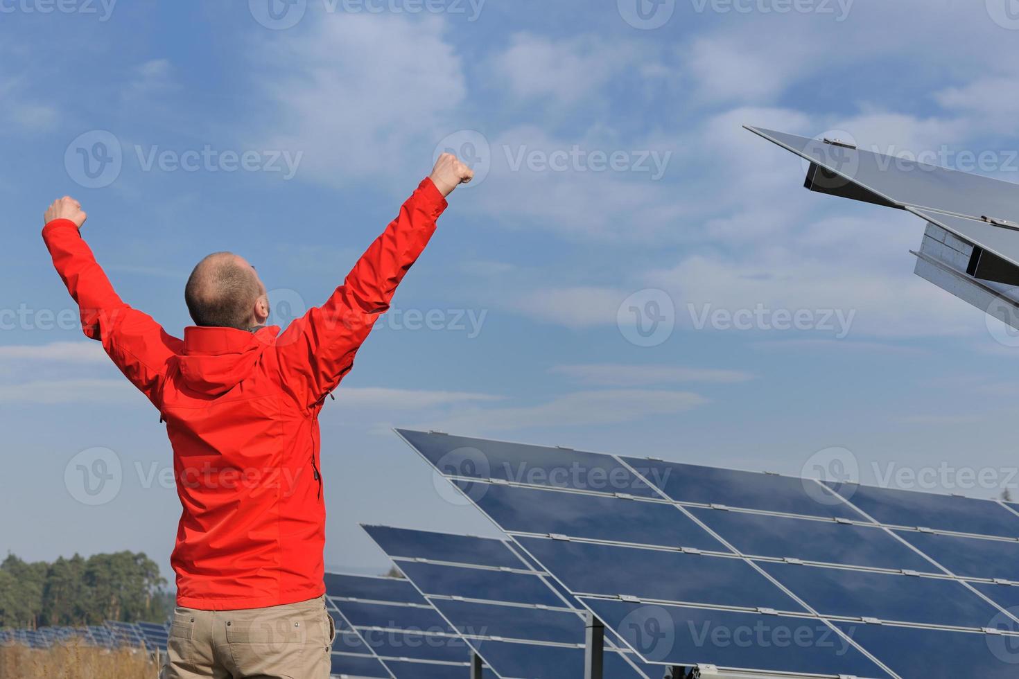 Male solar panel engineer at work place photo