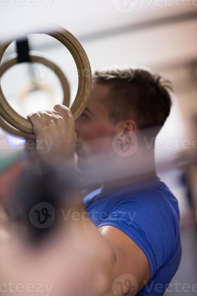 man doing dipping exercise photo