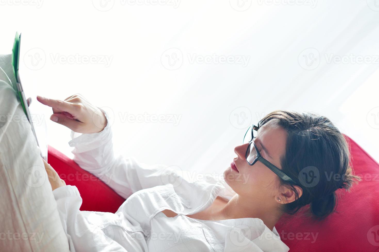 woman using tablet pc at home photo