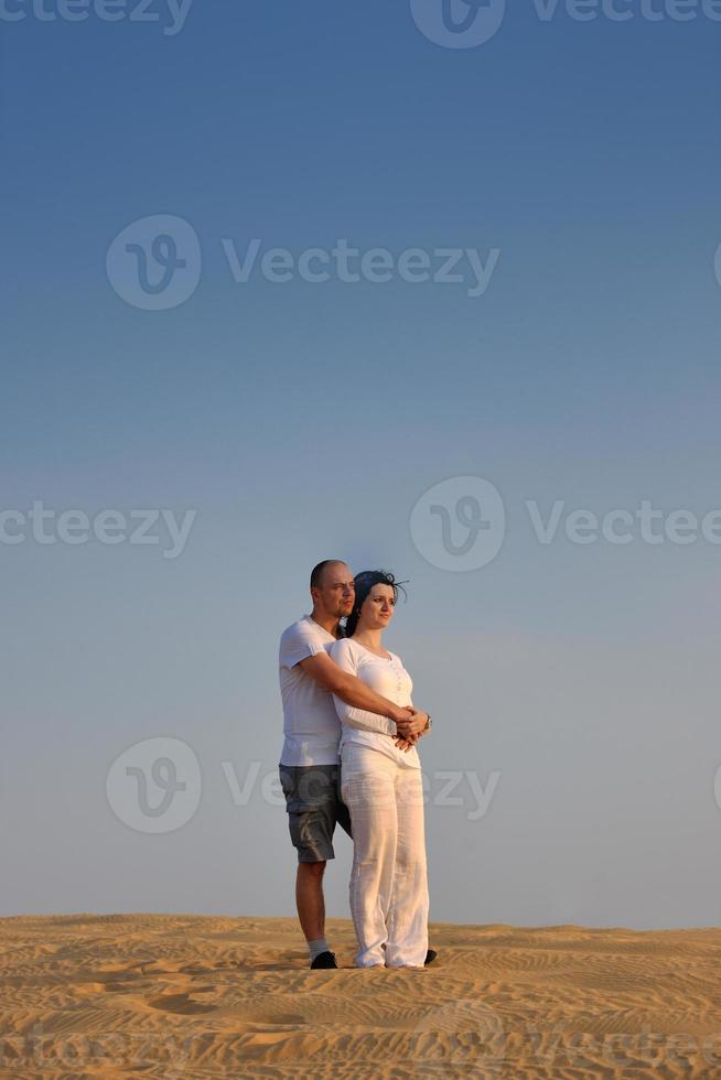 couple enjoying the sunset photo