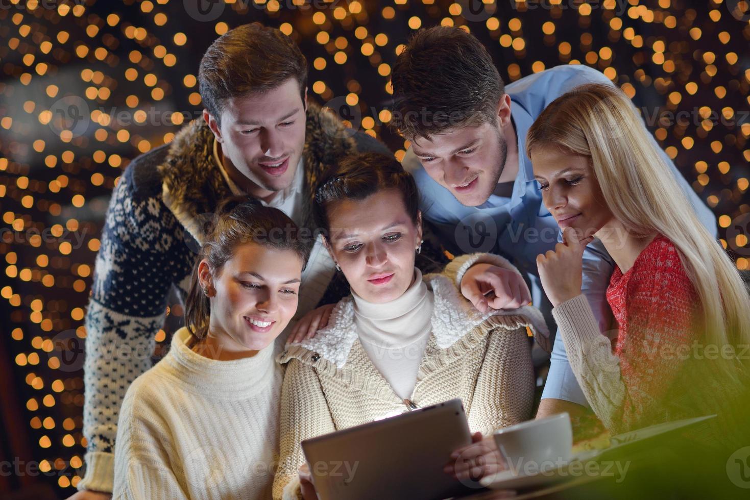 happy people looking at a tablet computer photo