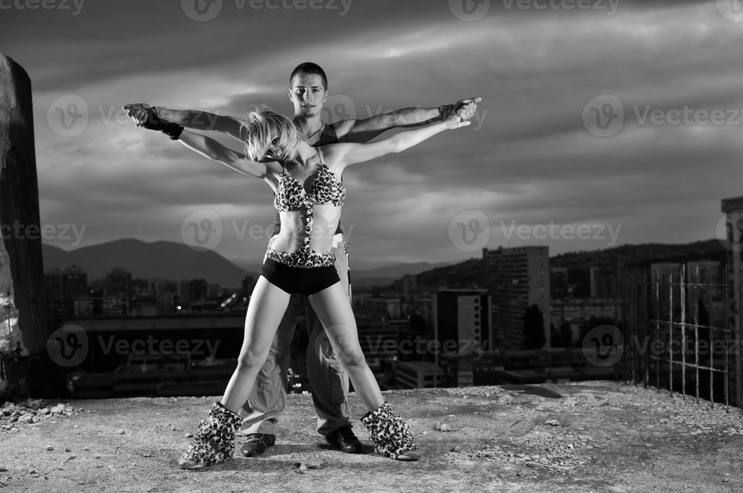 romantic urban couple dancing outdoor photo