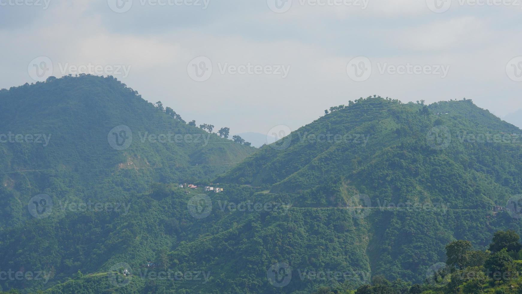 smoky image of uttarakhands green hills. photo