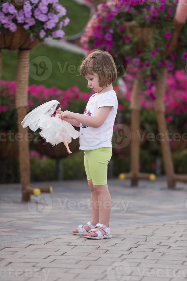 little girl with a doll photo