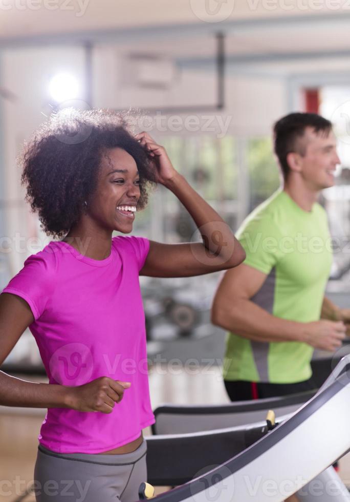 people exercisinng a cardio on treadmill photo