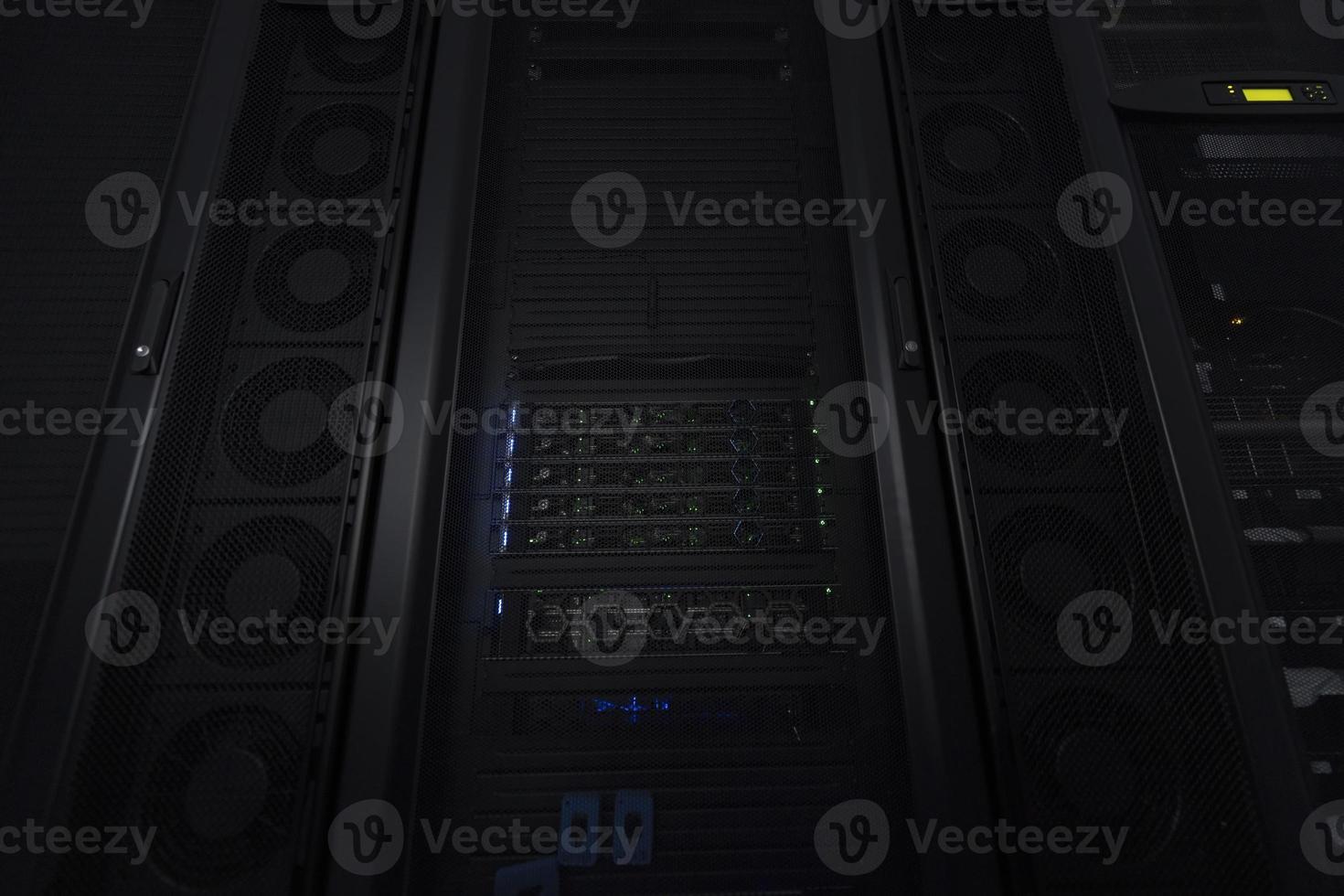 Data Center With Multiple Rows of Fully Operational Server Racks. Modern Telecommunications, Cloud Computing, Artificial Intelligence, Database, Supercomputer Technology Concept. photo