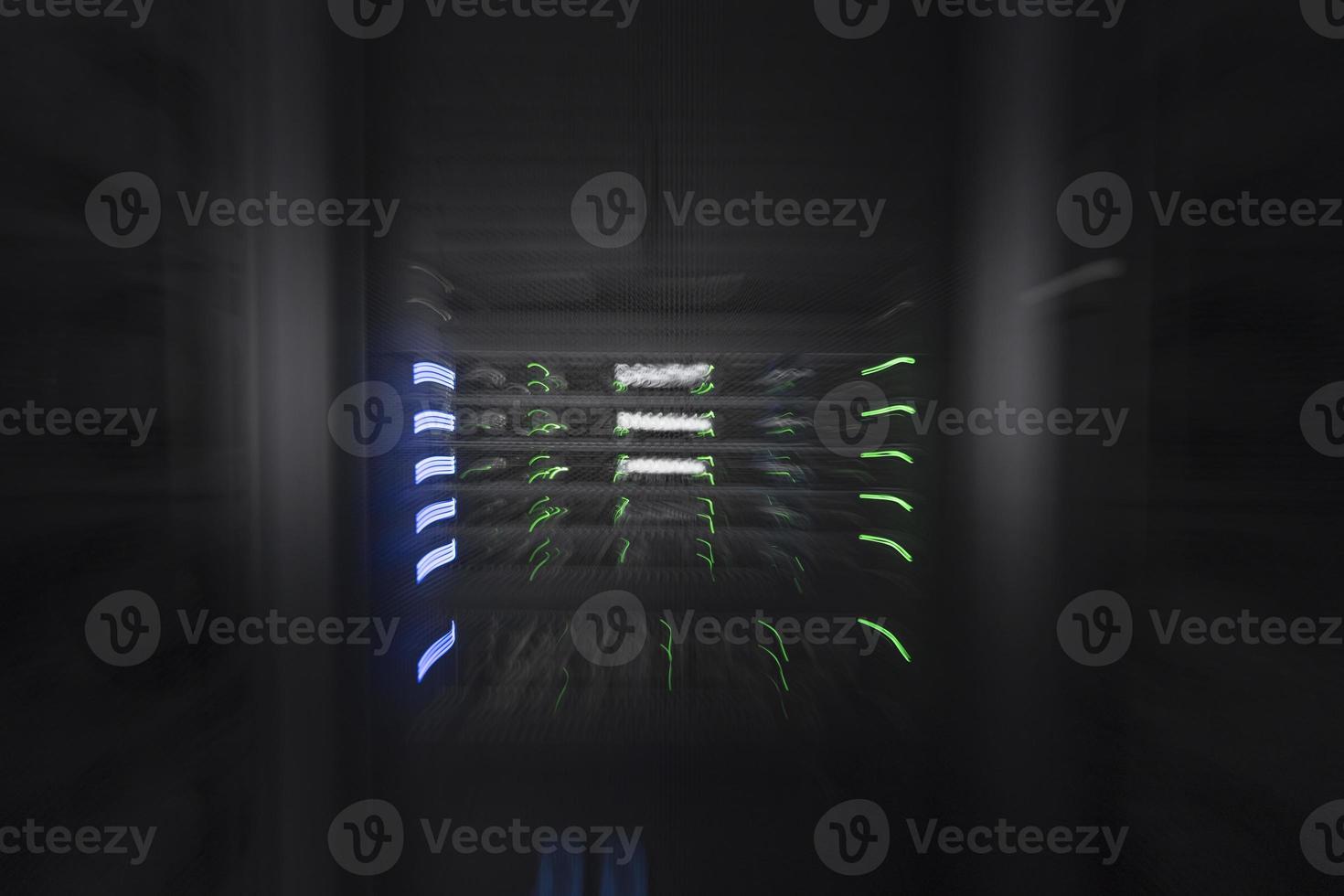 server room or data center supercomputer technology equipment, abstract close up of a server rack with motion blur. photo