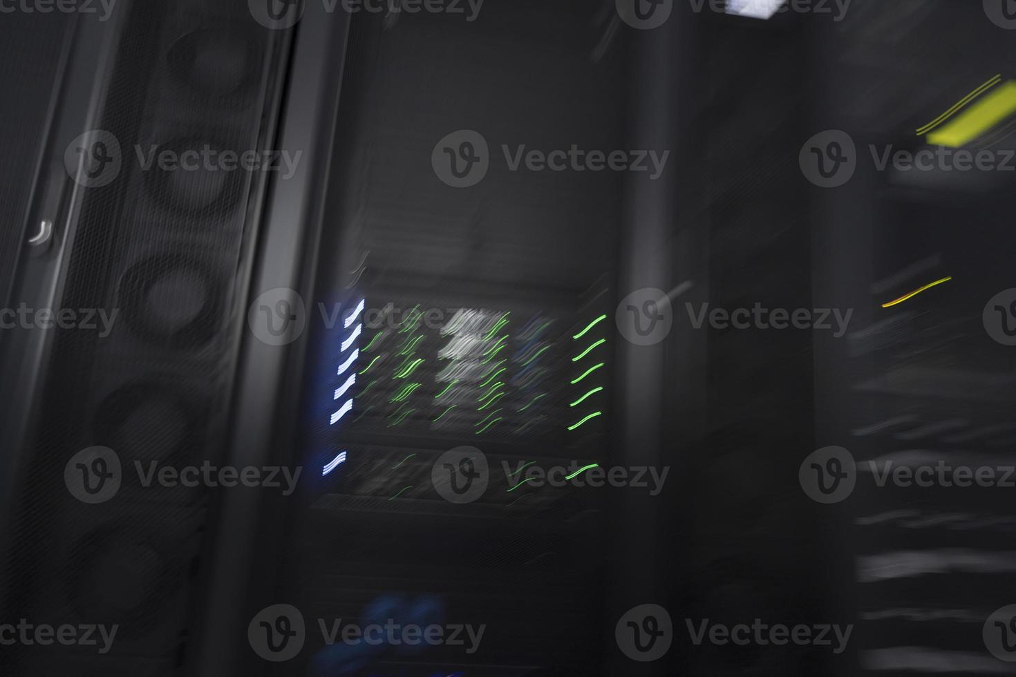 server room or data center supercomputer technology equipment, abstract close up of a server rack with motion blur. photo