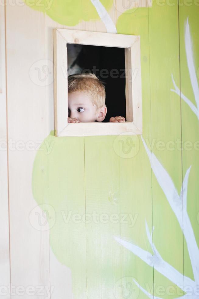 happy child in a window photo