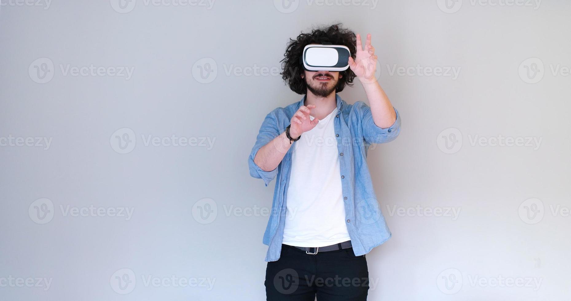 Man using headset of virtual reality photo