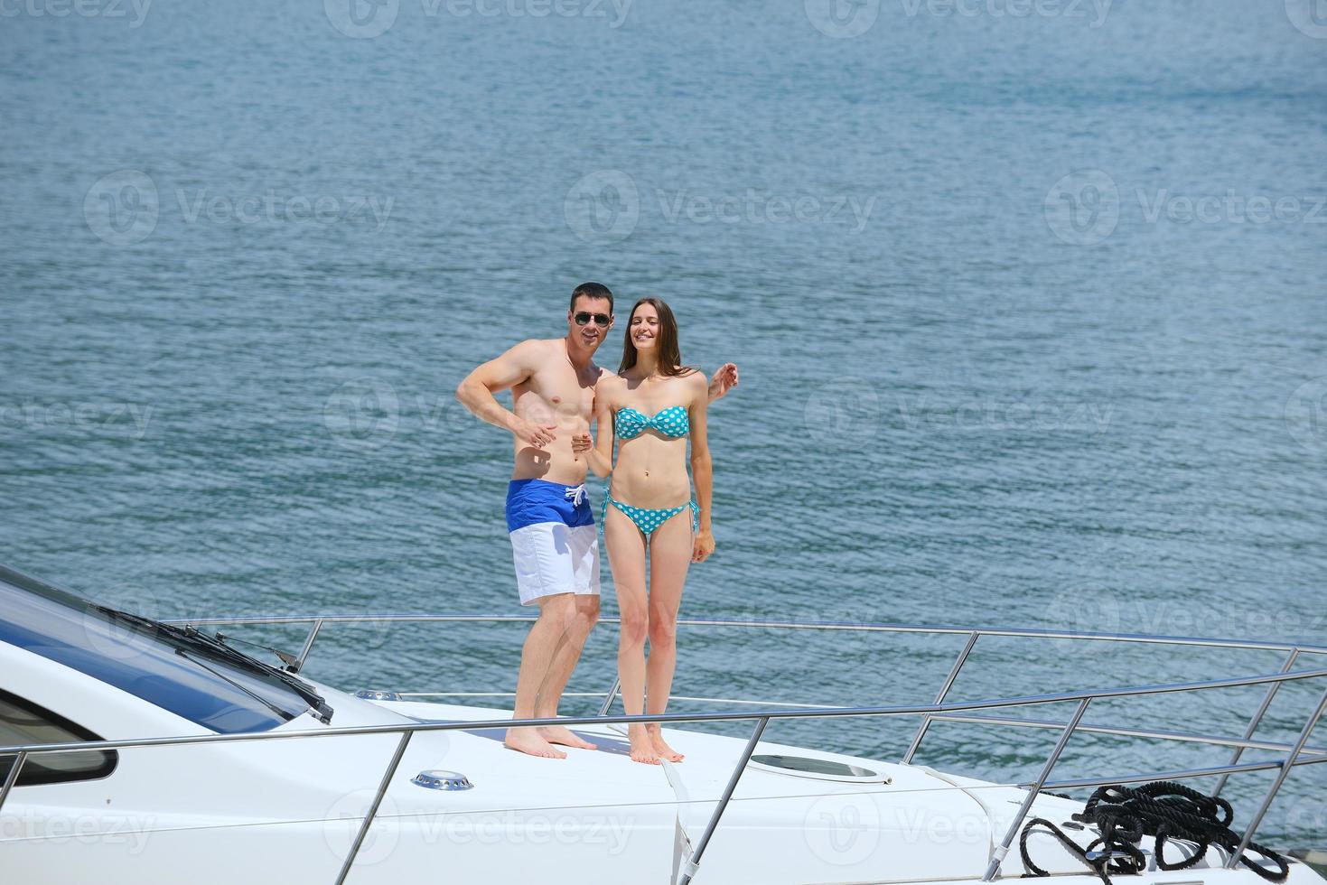 young couple on yacht photo