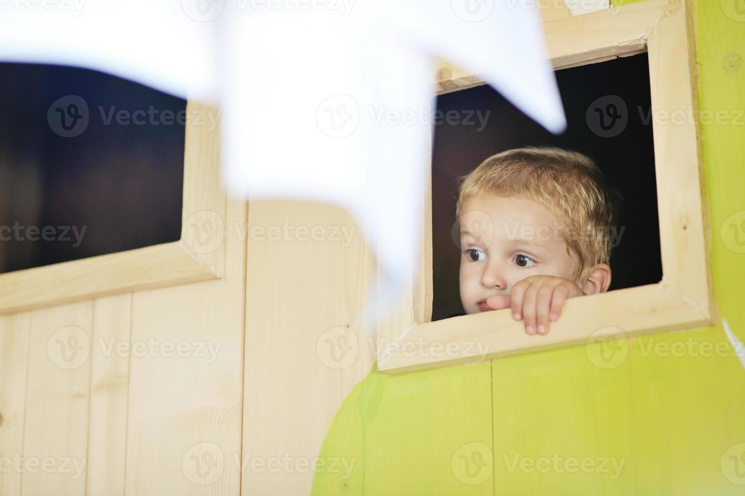 happy child in a window photo