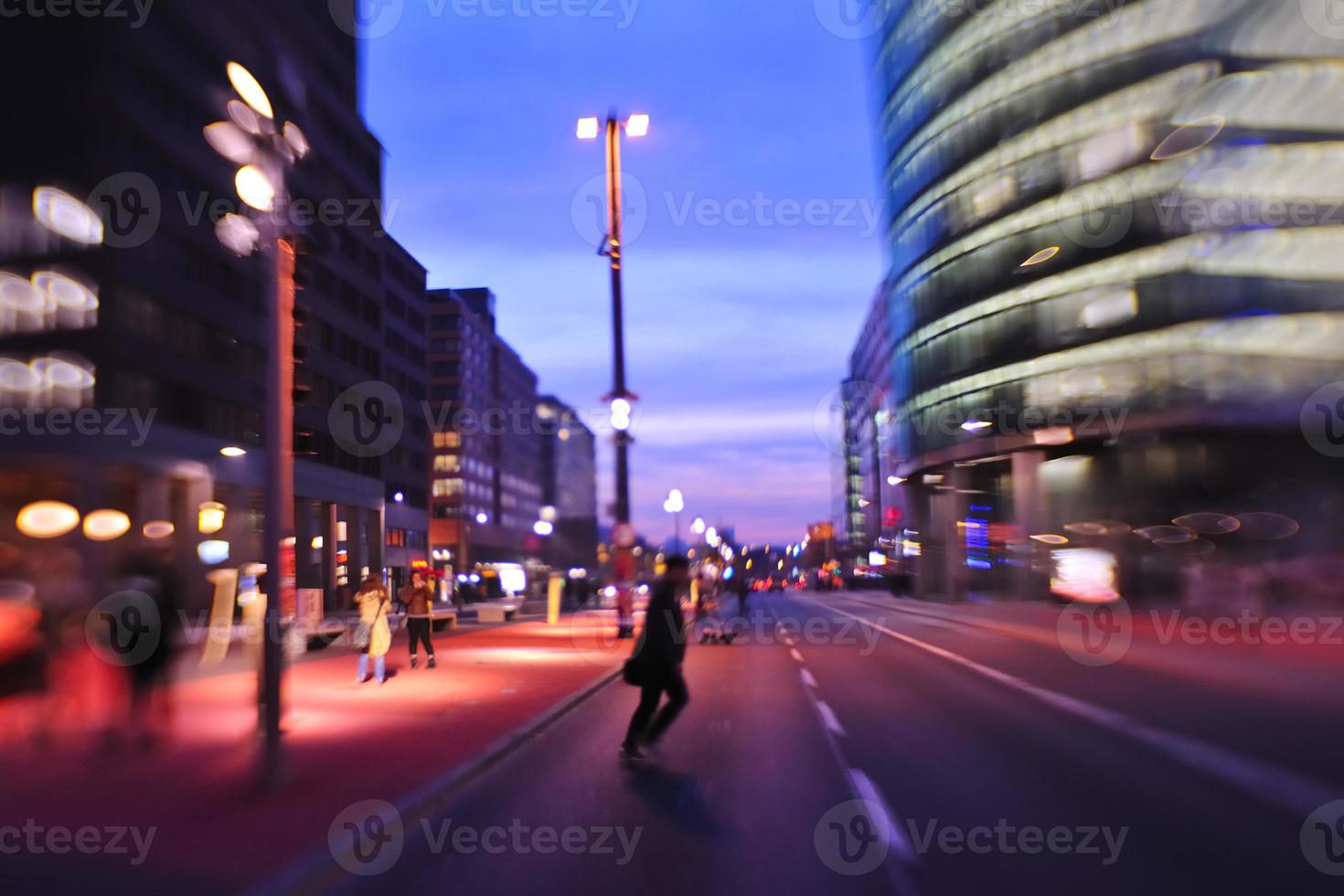 City night with cars motion blurred light in busy street photo