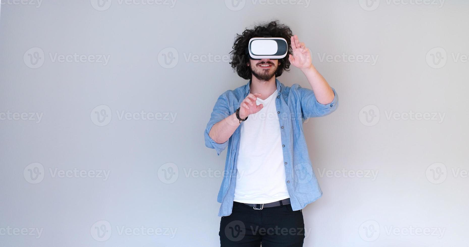 Man using headset of virtual reality photo