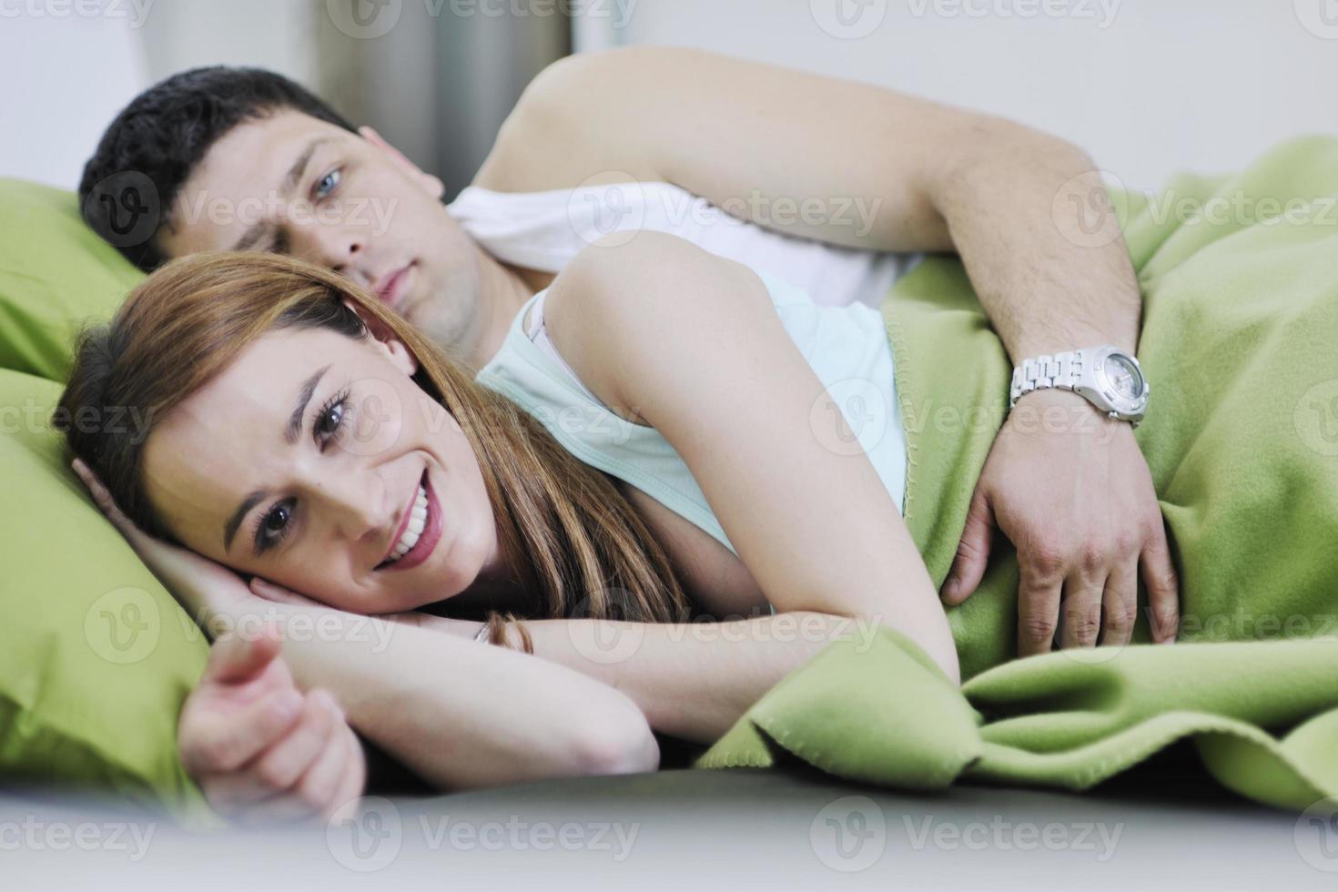 young couple in bed photo