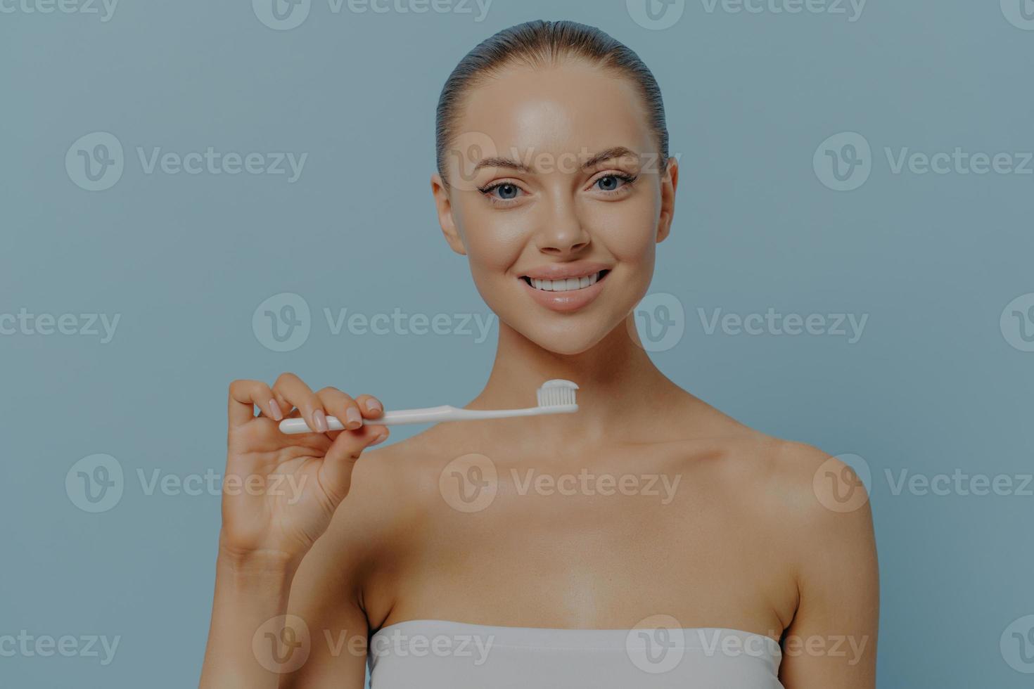 Dental. Young beautiful healthy woman holding toothbrush, brushing