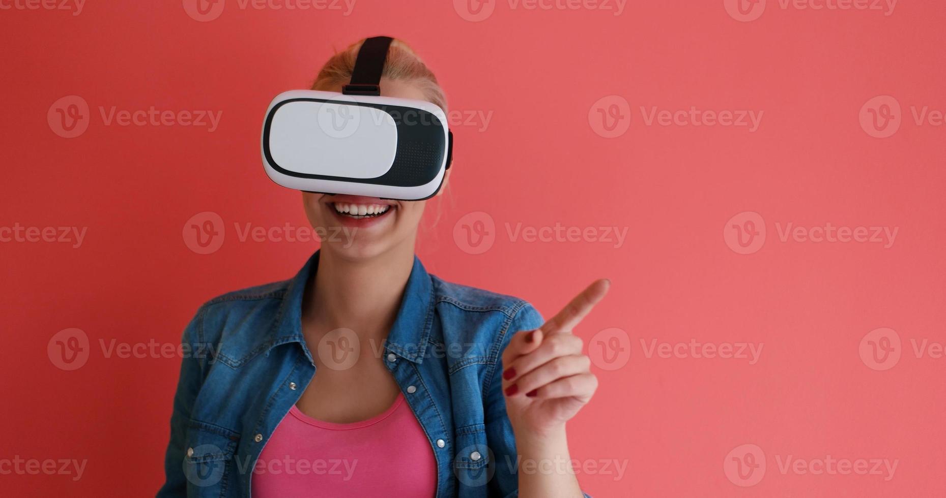 young girl using VR headset glasses of virtual reality photo