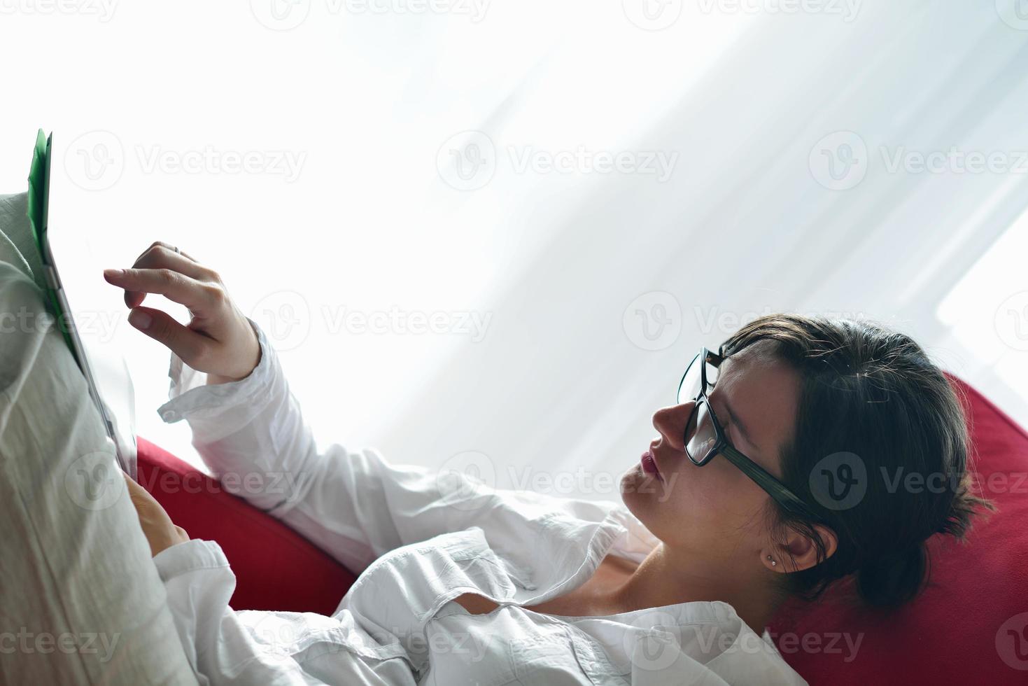 woman using tablet pc at home photo