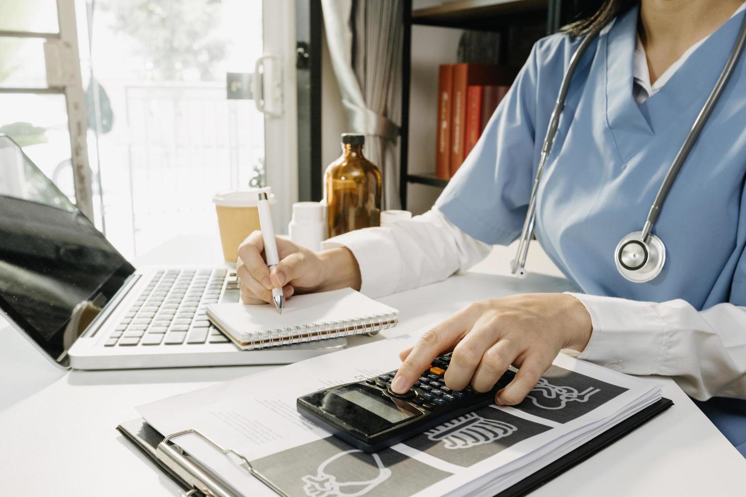 Medicine doctor and stethoscope touching icon medical network connection with modern interface on digital tablet in hospital background. Medical technology network concept photo