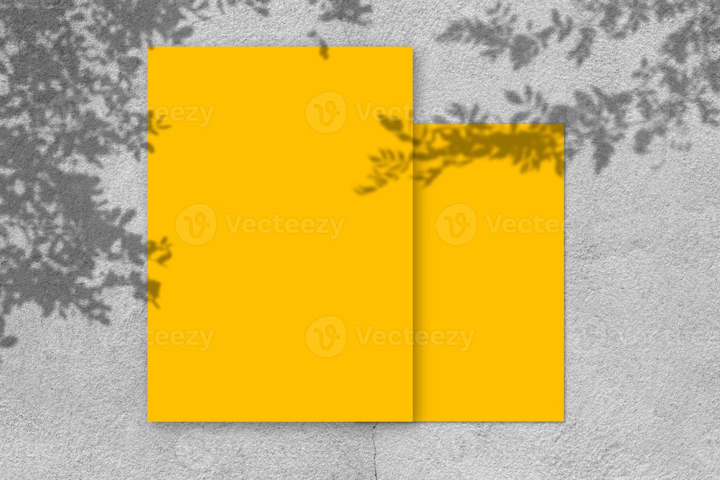 Empty yellow square poster mockup with light shadow on gray concrete wall background. photo