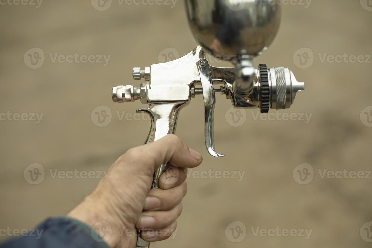 Paint sprayer. Tools for air and liquid paint. Chrome-plated steel. photo