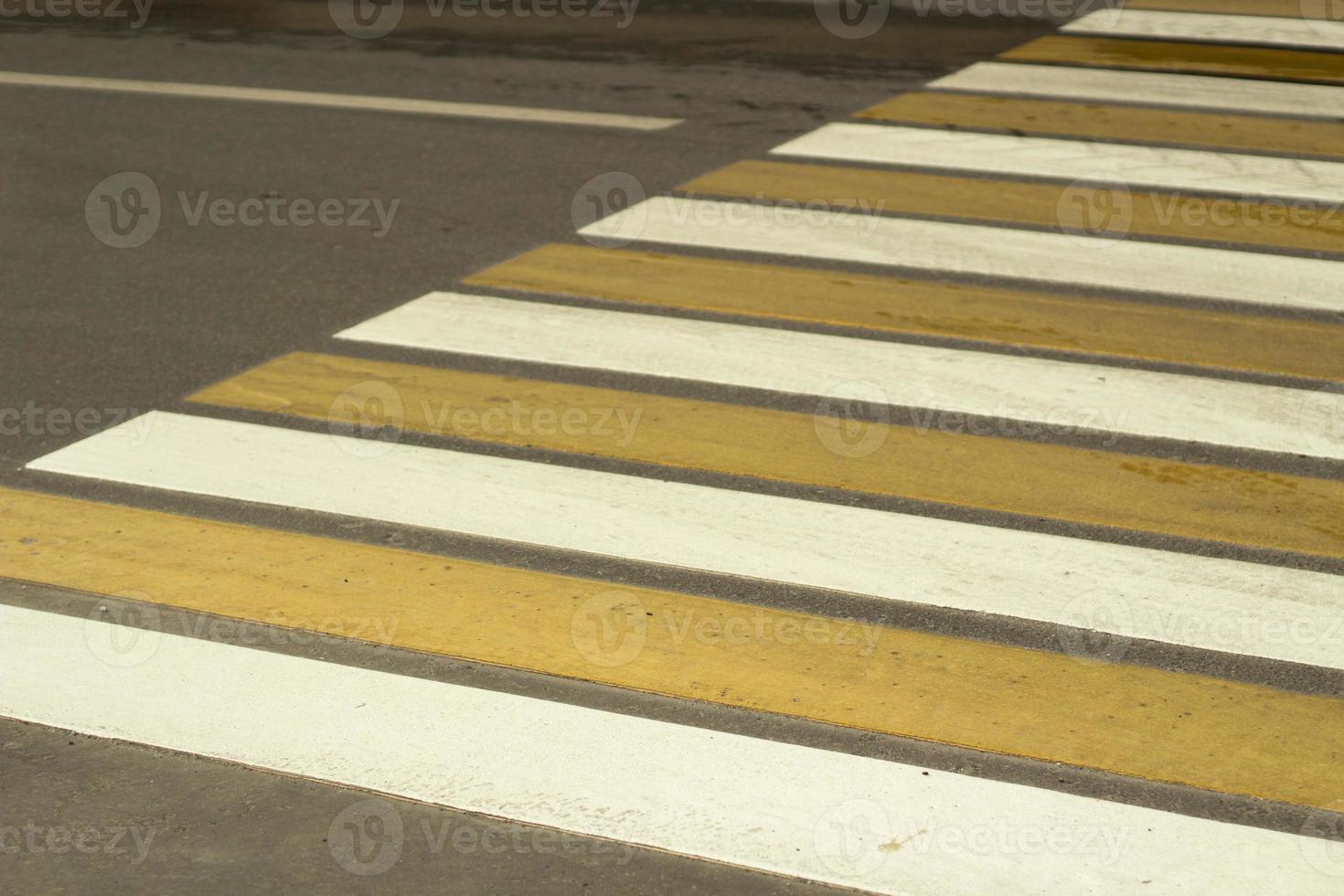 Pedestrian crossing. A place to cross the road. Warning strips for the car. photo