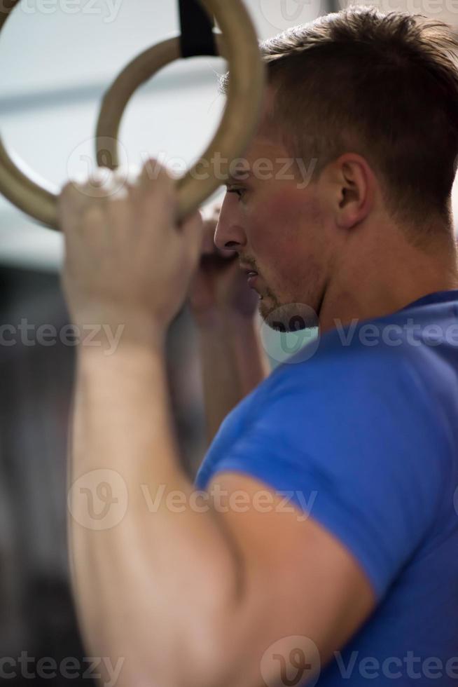 man doing dipping exercise photo