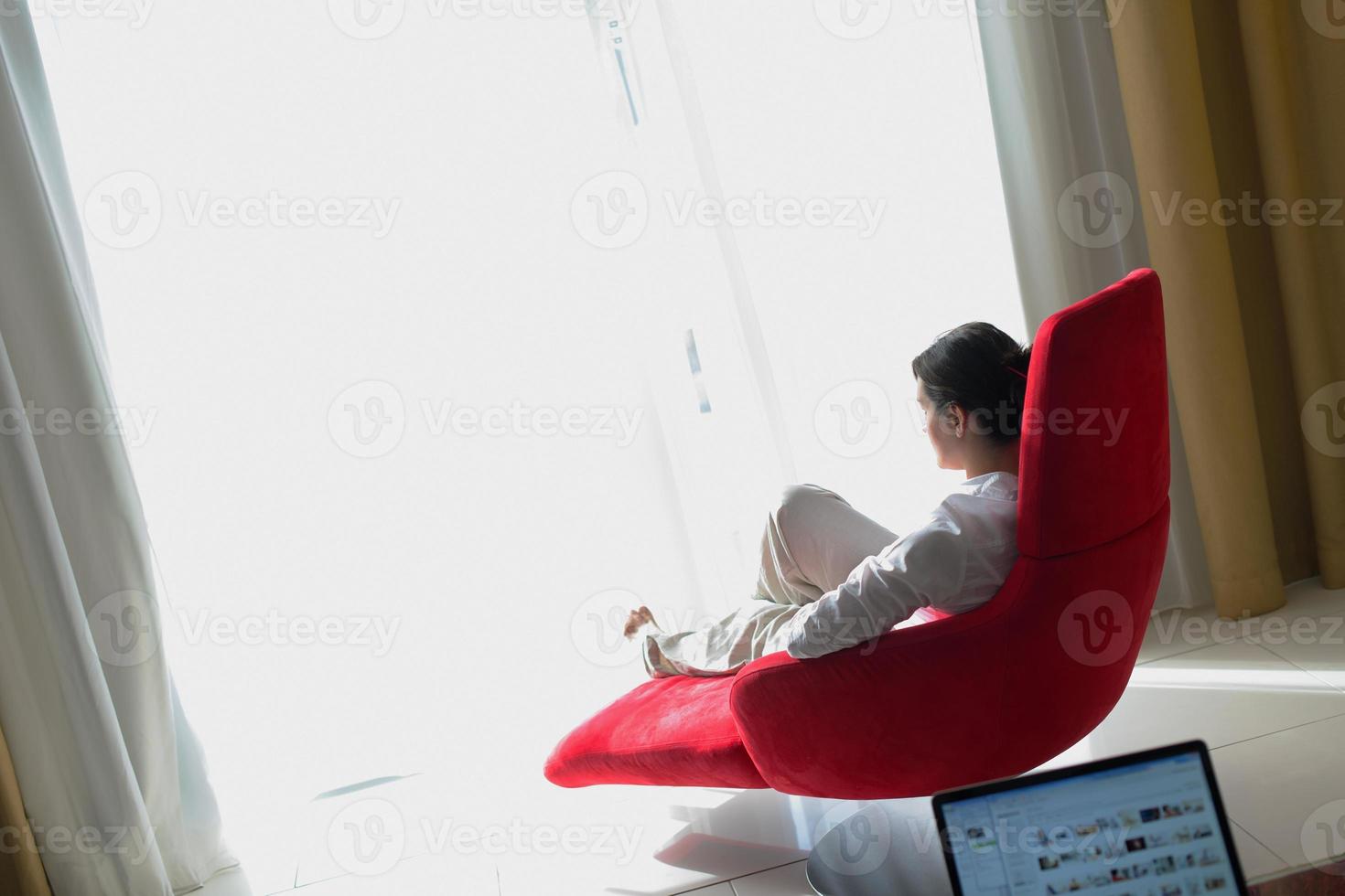 happy young woman relax at home on sofa photo