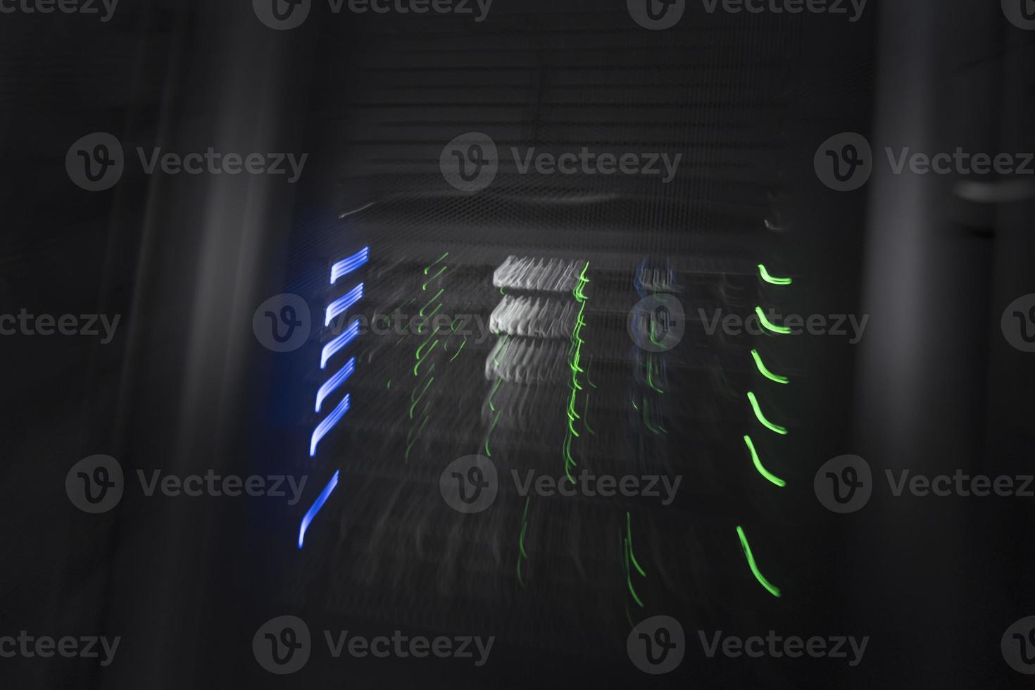 server room or data center supercomputer technology equipment, abstract close up of a server rack with motion blur. photo